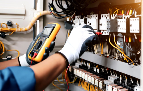 A technician connecting electrical components